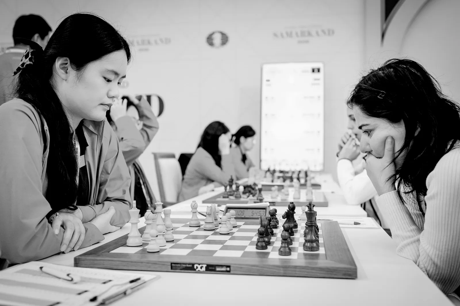 A Chinese player studies the board during a Women's section match in Samarkand.